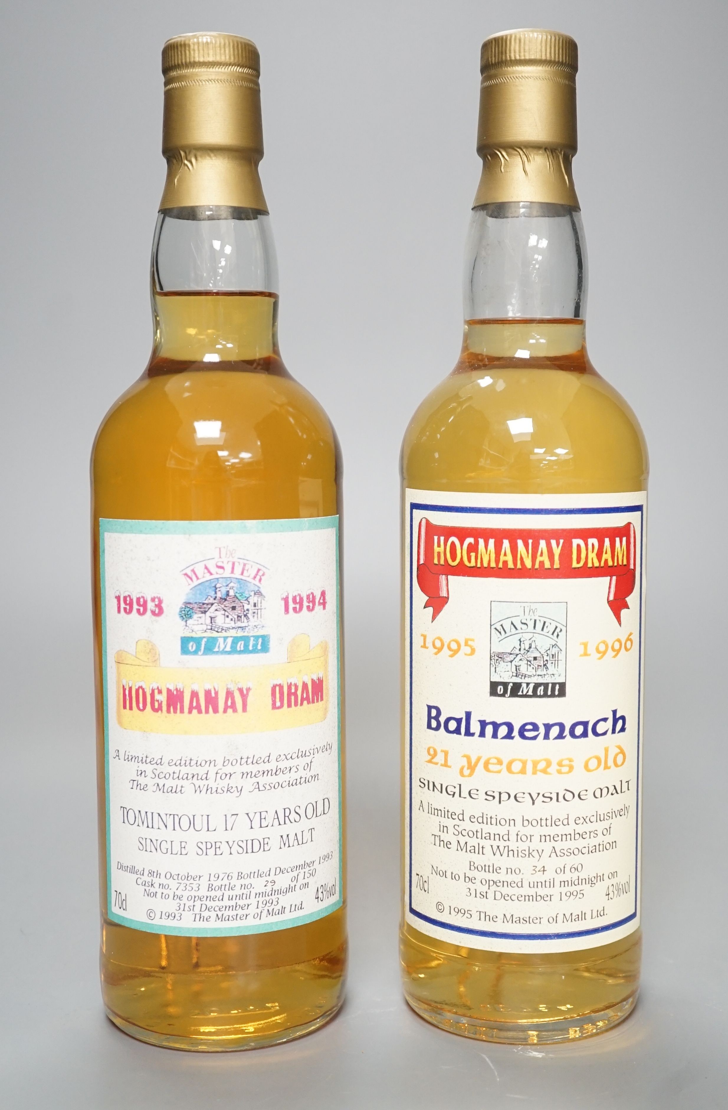 Two exclusive Master of Malt series whiskies: Hogmanay dram 1993/1994 Tomintoul 17 year old, distilled 8/10/76 bottled 12/1993 case no. 7353 bottle 29/150 and Balmenach 21 year old, bottle no. 34/60 'not to be opened unt